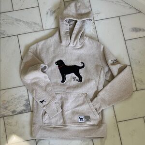 The Black Dog Tan Hoodie with Black Dog Motif